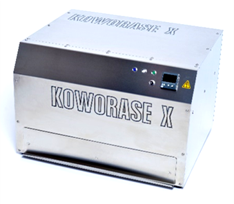 A small metallic container labeled "kowoerase x" on its exterior to erase digital films (imaging plate).