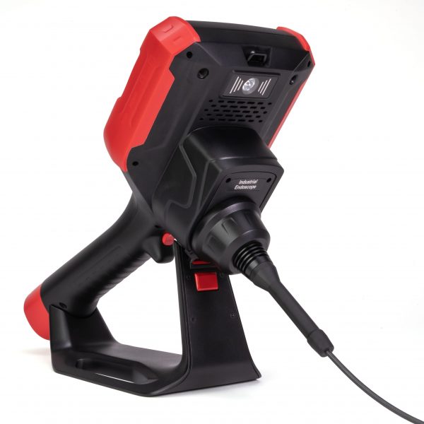 A red and black handheld device with a cord, designed for portable use in various applications.